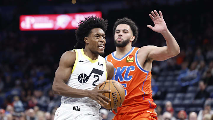 Dec 3, 2024; Oklahoma City, Oklahoma, USA; Utah Jazz guard Collin Sexton (2) drives to the basket beside Oklahoma City Thunder guard Ajay Mitchell (25) during the second half of an NBA Cup game at Paycom Center. Mandatory Credit: Alonzo Adams-Imagn Images