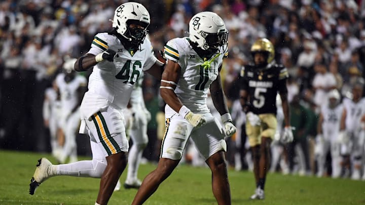 Sep 21, 2024; Boulder, Colorado, USA; Baylor Bears linebacker Keaton Thomas (11) celebrates after a sack during the second half against the Colorado Buffaloes at Folsom Field. Mandatory Credit: Christopher Hanewinckel-Imagn Images