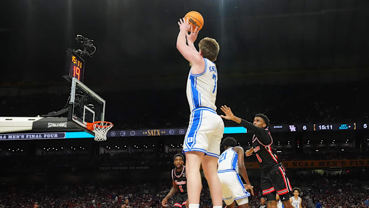 Apr 5, 2025; San Antonio, TX, USA; Duke Blue Devils guard Kon Knueppel (7) shoots against Houston Cougars guard Mylik Wilson (8) in the semifinals of the men's Final Four of the 2025 NCAA Tournament at the Alamodome. Mandatory Credit: Robert Deutsch-Imagn Images