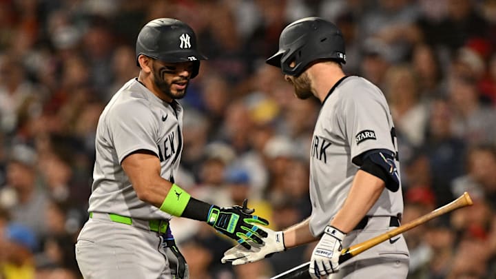 Sep 14, 2025; Boston, Massachusetts, USA; New York Yankees shortstop Jose Caballero (72) high-fives left fielder Austin Slater (29) after hitting a home run against the Boston Red Sox during the seventh inning at Fenway Park. Mandatory Credit: Brian Fluharty-Imagn Images