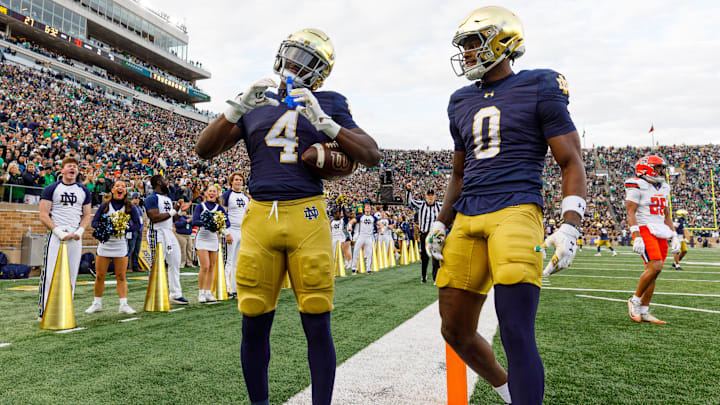 Notre Dame running back Jeremiyah Love (4) makes a heart sign after scoring a touchdown in the first half of a NCAA football game against Syracuse at Notre Dame Stadium on Saturday, Nov. 22, 2025, in South Bend.