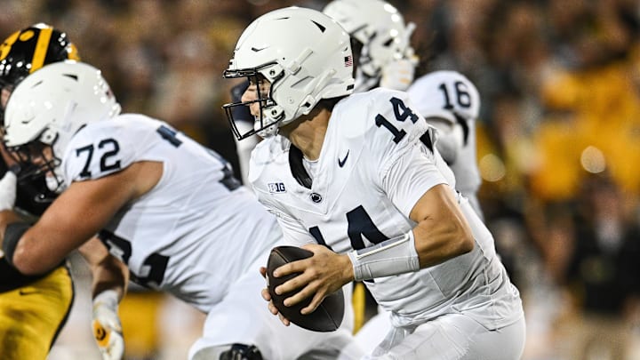 Penn State football quarterback Jaxon Smolik (14) scrambles during the first quarter against the Iowa Hawkeyes