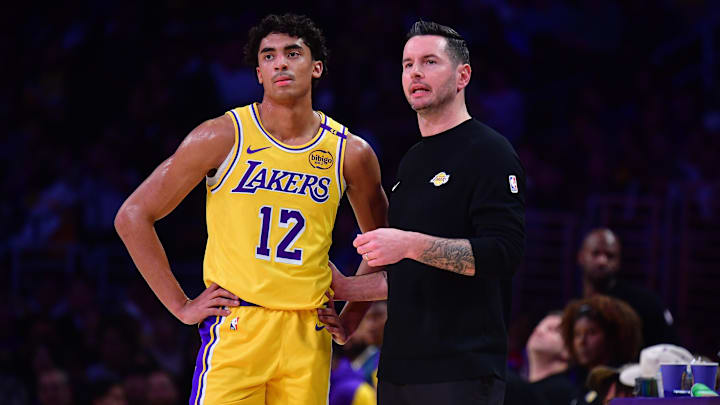 Dec 31, 2024; Los Angeles, California, USA; Los Angeles Lakers head coach JJ Redick speaks with guard Max Christie (12) during the first half at Crypto.com Arena. Mandatory Credit: Gary A. Vasquez-Imagn Images