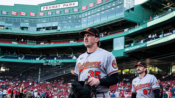Jun 3, 2026; Boston, Massachusetts, USA; Baltimore Orioles catcher Adley Rutschman (35) and field coordinator/catching coach Joe Singley (87) walk to the bullpen before the start of the game against the Boston Red Sox at Fenway Park. Mandatory Credit: David Butler II-Imagn Images Jun 3, 2026; Boston, Massachusetts, USA; Baltimore Orioles catcher Adley Rutschman (35) and field coordinator/catching coach Joe Singley (87) walk to the bullpen before the start of the game against the Boston Red Sox at Fenway Park. Mandatory Credit: David Butler II-Imagn Images