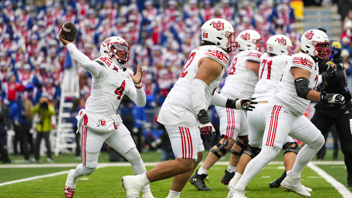 Utah Utes quarterback Devon Dampier (4) throws a pass during the first half against the Kansas Jayhawks at David Booth Kansas Memorial Stadium.