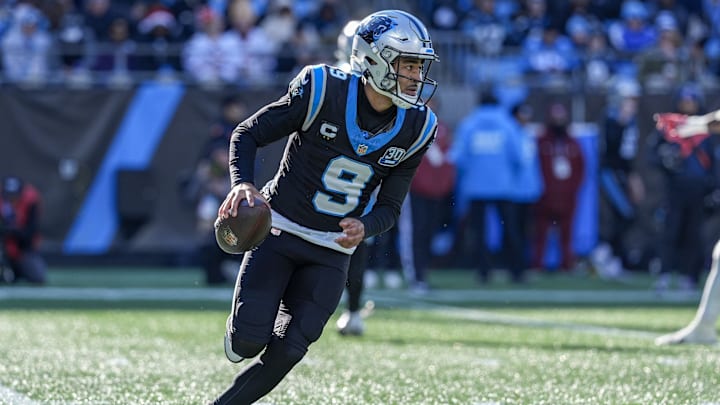 Dec 22, 2024; Charlotte, North Carolina, USA; Carolina Panthers quarterback Bryce Young (9) runs on a keeper play against the Arizona Cardinals during the second quarter at Bank of America Stadium. Mandatory Credit: Jim Dedmon-Imagn Images