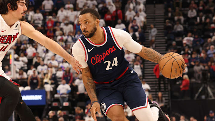 Jan 13, 2025; Inglewood, California, USA; LA Clippers guard Norman Powell (24) drives against Miami Heat guard Jaime Jaquez Jr. (11) during the second quarter at Intuit Dome. Mandatory Credit: Jason Parkhurst-Imagn Images
