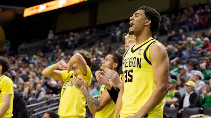 Oregon forward Miles Stewart celebrates from the bench as the Oregon Ducks host the Wisconsin Badgers on Feb. 25, 2026, at Matthew Knight Arena in Eugene, Oregon.