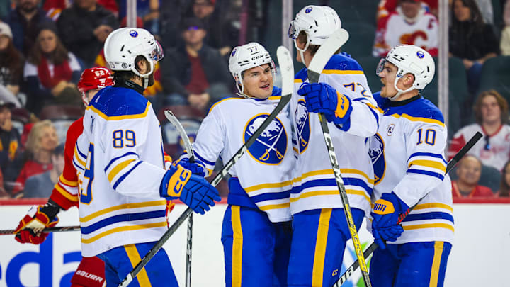 Mar 24, 2024; Calgary, Alberta, CAN; Buffalo Sabres right wing JJ Peterka (77) celebrates his goal with teammates against the Calgary Flames during the third period at Scotiabank Saddledome. Mandatory Credit: Sergei Belski-USA TODAY Sports