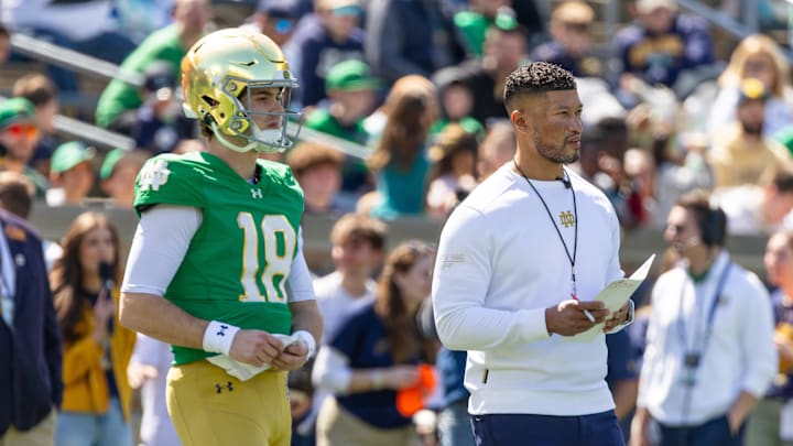 Apr 12, 2025; Notre Dame, IN, USA; Notre Dame Fighting Irish quarterback Steve Angeli (18) watches alongside head coach Marcus Freeman during the Blue-Gold game at Notre Dame Stadium. Apr 12, 2025; Notre Dame, IN, USA; Notre Dame Fighting Irish quarterback Steve Angeli (18) watches alongside head coach Marcus Freeman during the Blue-Gold game at Notre Dame Stadium.
