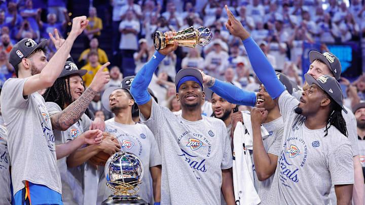 May 28, 2025; Oklahoma City, Oklahoma, USA; Oklahoma City Thunder guard Shai Gilgeous-Alexander holds up the Western Conference Finals MVP trophy for the 2025 NBA Playoffs at Paycom Center. Mandatory Credit: Alonzo Adams-Imagn Images