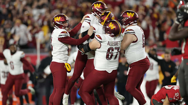 Washington Commanders place kicker Zane Gonzalez celebrates with teammates after kicking the game-wining field goal against the Tampa Bay Buccaneers.