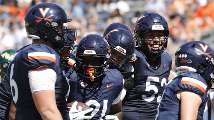 Sep 13, 2025; Charlottesville, Virginia, USA; Virginia Cavaliers running back Harrison Waylee (21) celebrates with teammates after scoring a touchdown against the William & Mary Tribe during the second quarter at Scott Stadium. Mandatory Credit: Amber Searls-Imagn Images Sep 13, 2025; Charlottesville, Virginia, USA; Virginia Cavaliers running back Harrison Waylee (21) celebrates with teammates after scoring a touchdown against the William & Mary Tribe during the second quarter at Scott Stadium. Mandatory Credit: Amber Searls-Imagn Images