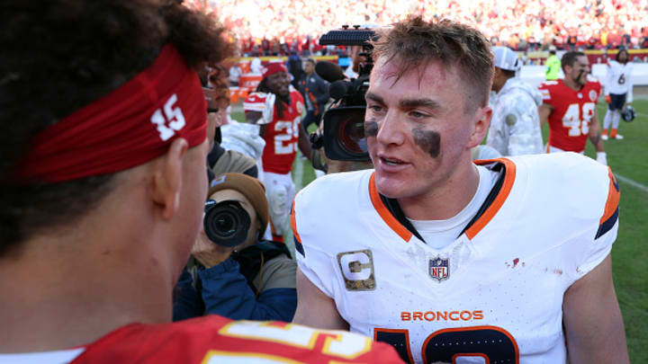 Denver Broncos QB Bo Nix greets Kansas City Chiefs QB Patrick Mahomes after the game.