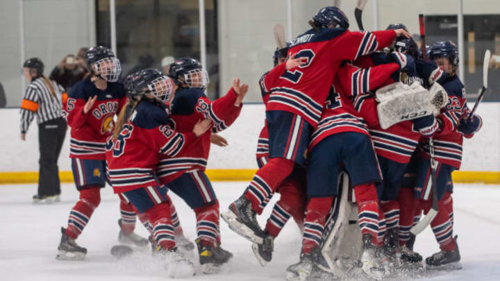 Orono girls hockey celebrates winning a section tournament in 2023.