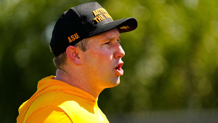 Arizona State head coach Kenny Dillingham yells to his defensive linemen as they run a drill during the first day of fall practice in Tempe, Ariz. on July 30, 2025.
