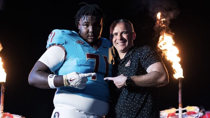 Peyton Joseph poses with Florida State coach Mike Norvell