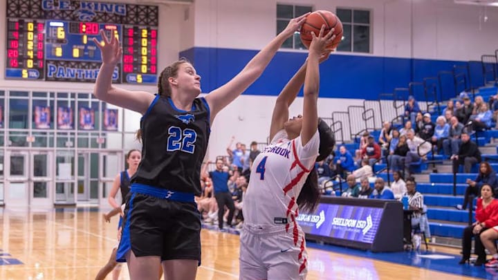 Friendswood junior Tabitha Gotsch (22) blocks a shot against Beaumont West Brook on Feb. 10 at C.E. King High School in Houston. 