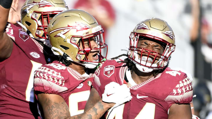Oct 1, 2022; Tallahassee, Florida, USA; Florida State Seminoles defensive end Patrick Payton (56) celebrates a sack with defensive tackle Joshua Farmer (44) during the second half against the Wake Forest Demon Deacons at Doak S. Campbell Stadium. Mandatory Credit: Melina Myers-USA TODAY Sports