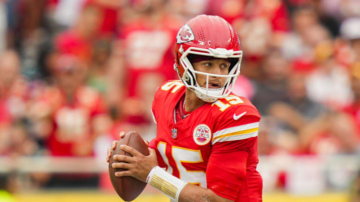 Sep 14, 2025; Kansas City, Missouri, USA; Kansas City Chiefs quarterback Patrick Mahomes (15) rolls out to pass during the first half against the Philadelphia Eagles at GEHA Field at Arrowhead Stadium. Mandatory Credit: Jay Biggerstaff-Imagn Images