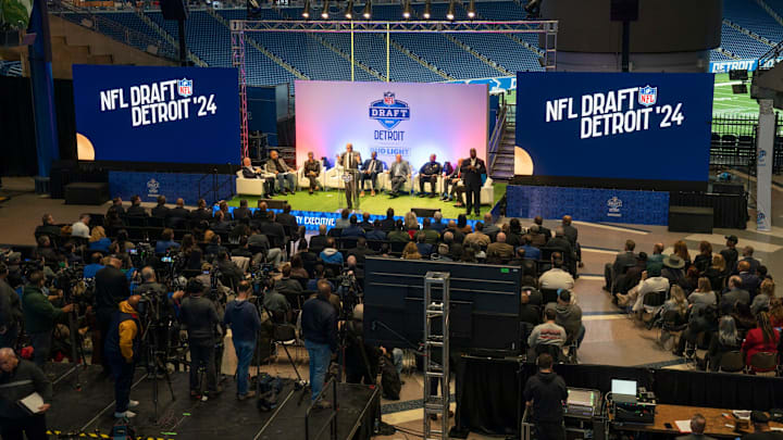 Wayne County Executive Warren C. Evans takes the stage during a news conference at Ford Field on