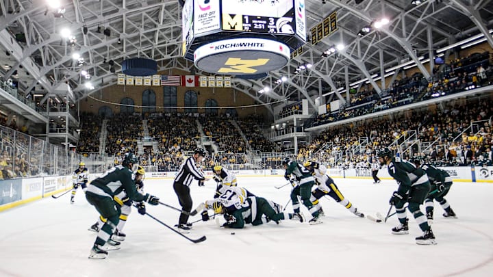 Michigan State center Red Savage and Michigan center TJ Hughes face off during the third period at Yost Ice Arena in Ann Arbor on Friday, Feb. 9, 2024.