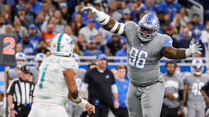 Detroit Lions defensive end Isaiah Buggs (96) tries to block a pass from Miami Dolphins quarterback Tua Tagovailoa (1) during the first half at Ford Field in Detroit on Sunday, Oct. 30, 2022.