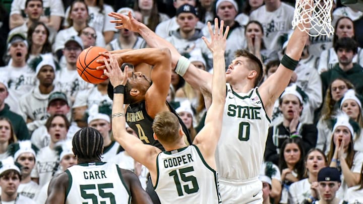 Michigan State's Jaxon Kohler, right, and Carson Cooper, center, challenge a shot by Purdue's Trey Kaufman-Renn 