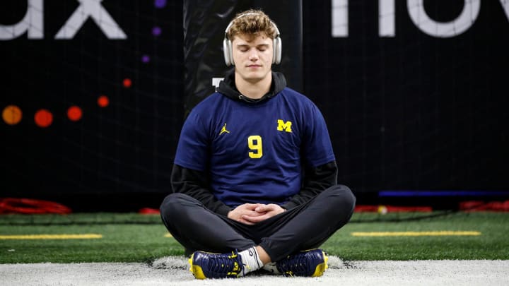 Michigan quarterback J.J. McCarthy meditates during warmups before the Big Ten championship game. Michigan quarterback J.J. McCarthy meditates during warmups before the Big Ten championship game.