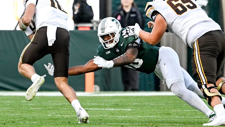 Michigan State's Wayne Matthews III, right, tackles Western Michigan's Brady Jones during the first quarter on Friday, Aug. 29, 2025, in East Lansing.
