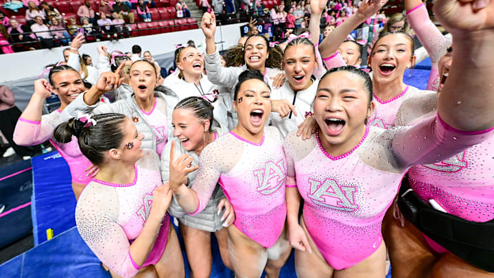The No. 11 Auburn Gymnastics Team celebrates their win over the No. 17 Alabama Crimson Tide at Coleman Coliseum in Tuscaloosa, AL on Friday, Feb. 21, 2025.