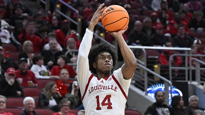 Mar 3, 2026; Louisville, Kentucky, USA;  Louisville Cardinals guard Adrian Wooley (14) shoots against the Syracuse Orange during the second half at KFC Yum! Center. Louisville defeated Syracuse 77-62. Mandatory Credit: Jamie Rhodes-Imagn Images