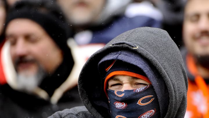 Chicago Bears fans bundle up in the cold weather at Solider Field, where the temperature is in the 20's with winds gusting to 15 mph.