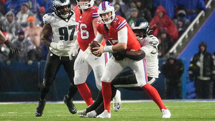 Dec 28, 2025; Orchard Park, New York, USA; Philadelphia Eagles linebacker Jalyx Hunt (58) sacks Buffalo Bills quarterback Josh Allen (17) during the first quarter at Highmark Stadium