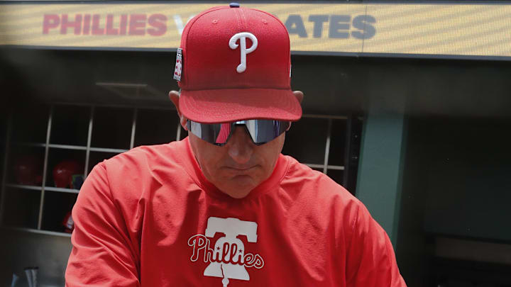 Jul 21, 2024; Pittsburgh, Pennsylvania, USA;  Philadelphia Phillies Philadelphia Phillies manager Rob Thomson (59) prepares in the dugout to play the Pittsburgh Pirates at PNC Park