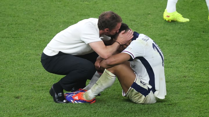 Bellingham was consoled on the pitch by England manager Gareth Southgate Bellingham was consoled on the pitch by England manager Gareth Southgate