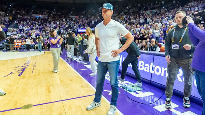 LSU Football Coach Lane Kiffin walks out with Tigers Basketball Coach Kim Mulkey, LSU Tigers Womens Basketball takes on the Kentucky Wildcats. Thursday, Jan. 1, 2026.