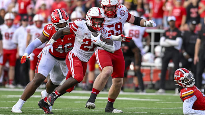 Oct 11, 2025; College Park, Maryland, USA;  Nebraska Cornhuskers running back Emmett Johnson (21) rushes as Maryland Terrapins defensive lineman Dillan Fontus (46) pursues during the first half at SECU Stadium. Mandatory Credit: Tommy Gilligan-Imagn Images Oct 11, 2025; College Park, Maryland, USA;  Nebraska Cornhuskers running back Emmett Johnson (21) rushes as Maryland Terrapins defensive lineman Dillan Fontus (46) pursues during the first half at SECU Stadium. Mandatory Credit: Tommy Gilligan-Imagn Images