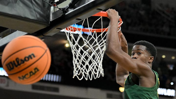 Mar 21, 2025; Raleigh, NC, USA; Baylor Bears guard VJ Edgecombe (7) hangs on the rim 