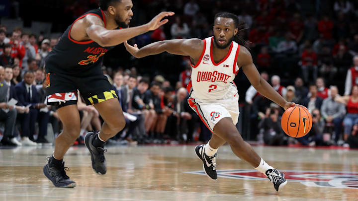 Ohio State Buckeyes guard Bruce Thornton (2) dribbles the ball past Maryland Terrapins forward Donta Scott (24) during the second half at Value City Arena.
