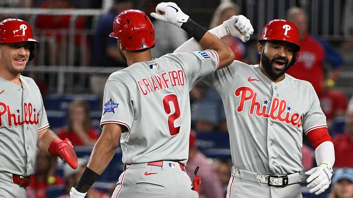 Jun 25, 2026; Washington, District of Columbia, USA; Philadelphia Phillies right fielder Derek Hill (49) is congratulated by  center fielder Justin Crawford (2) after hitting a two run home run against the Washington Nationals during the ninth inning at Nationals Park.