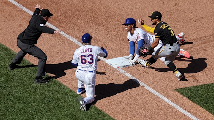 Francisco Lindor (12) slides safely into third base for a triple Francisco Lindor (12) slides safely into third base for a triple