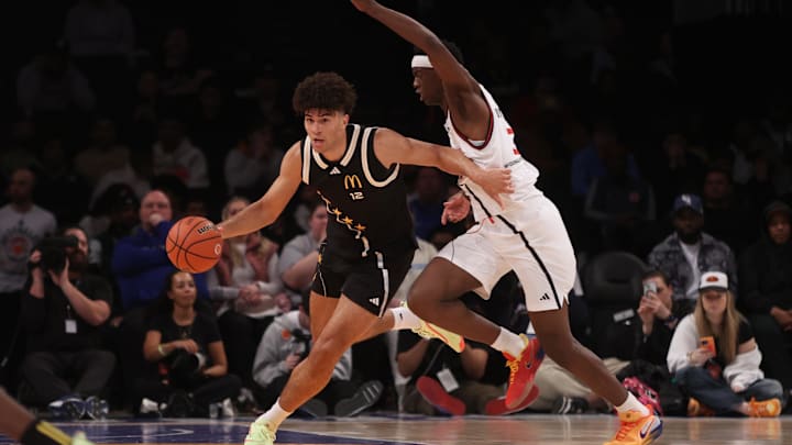 Apr 1, 2025; Brooklyn, NY, USA; Duke basketball forward Cameron Boozer (12) dribbles the ball against McDonald's All American West forward AJ Dybantsa (3) during the second half of the game at Barclays Center.