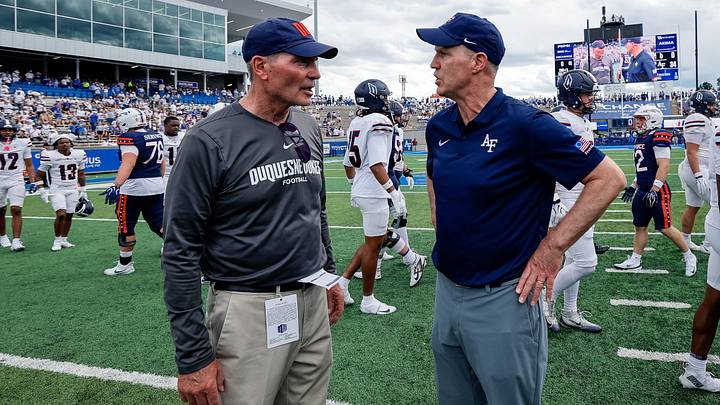 Duquesne Dukes coach Jerry Schmitt and Air Force Falcons head coach Troy Calhoun after the game at Falcon Stadium to begin 2026 season. Duquesne Dukes coach Jerry Schmitt and Air Force Falcons head coach Troy Calhoun after the game at Falcon Stadium to begin 2026 season.
