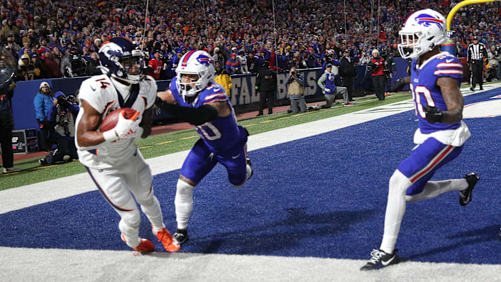 Denver Broncos wide receiver Courtland Sutton (14) manages to keep his feet inbounds for a touchdown against Buffalo Bills safety Taylor Rapp (20). Denver Broncos wide receiver Courtland Sutton (14) manages to keep his feet inbounds for a touchdown against Buffalo Bills safety Taylor Rapp (20).