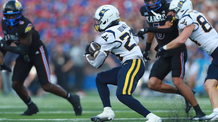 West Virginia Mountaineers running back Cyncir Bowers (23) runs the ball during the first half of the game against Kansas Jayhawks at David Booth Kansas Memorial Stadium on Sept. 20, 2025.