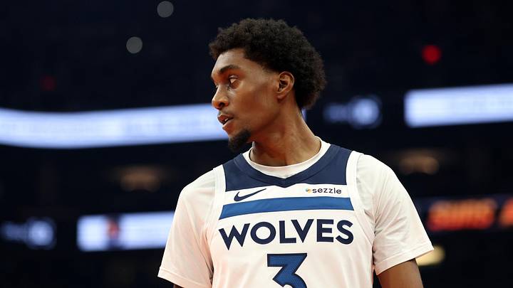Nov 21, 2025; Phoenix, Arizona, USA; Minnesota Timberwolves forward Jaden McDaniels (3) against the Phoenix Suns during an NBA Cup game at Mortgage Matchup Center. Mandatory Credit: Mark J. Rebilas-Imagn Images