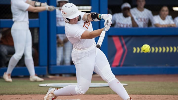 Jun 6, 2025; Oklahoma City, OK, USA;  Texas Longhorns utility Katie Stewart (20) hits a single in the first inning against the Texas Tech Red Raiders during game three of the NCAA Softball Women's College World Series finals at Devon Park. Mandatory Credit: Brett Rojo-Imagn Images