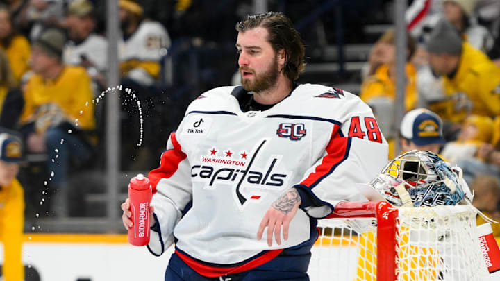 Jan 11, 2025; Nashville, Tennessee, USA;  Washington Capitals goaltender Logan Thompson (48) relaxes during a break in action against the Nashville Predators during the first period at Bridgestone Arena. Mandatory Credit: Steve Roberts-Imagn Images