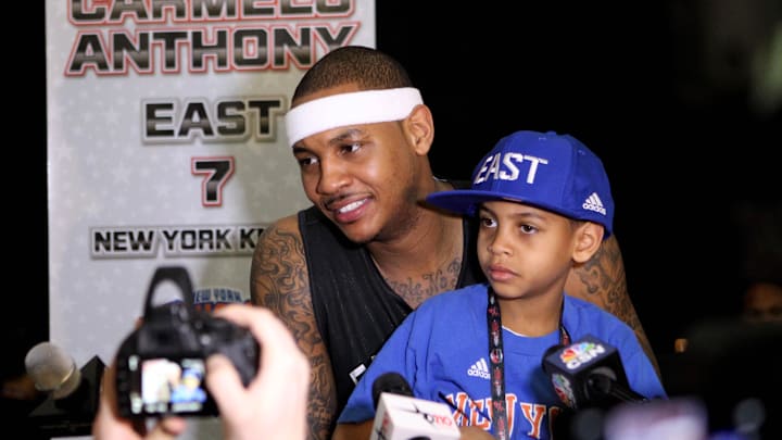 Feb 16, 2013; Houston, TX, USA; Eastern Conference forward Carmelo Anthony (7) of the New York Knicks holds his son Kiyan Carmelo Anthony during the media availability for the 2013 NBA all star game at the George R. Brown Convention Center. Mandatory Credit: Brett Davis-Imagn Images